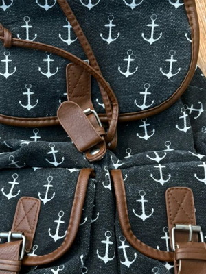 Backpack with anchor design and leather details like new