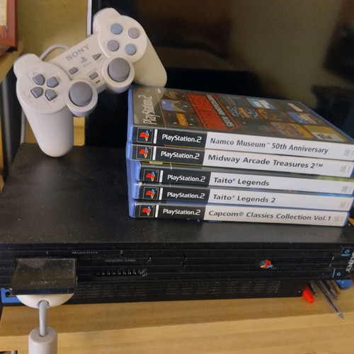 Sony PlayStation 2 used with games, joystick and memory card