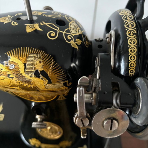 Singer sewing machine in carved furniture used, antique