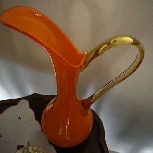 Vintage orange pitcher with slight handle defect