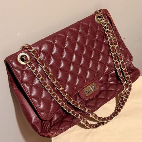 Italian leather shoulder bag used with wear on corners and chain