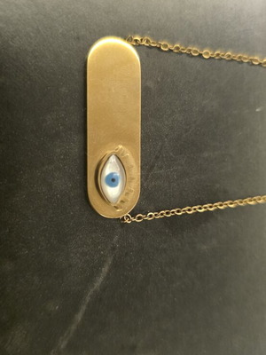 Stainless steel necklace like new, gold color with eye pendant