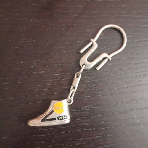 Vintage metal Aris sneaker keychain used