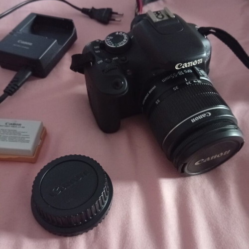 Canon EOS600D camera with 18-55mm lens, strap, charger, and two batteries