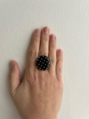 Ring used with black and beige polka dot design