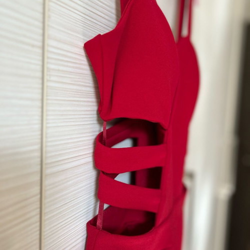 Red one-piece jumpsuit like new with side cutouts and bust support