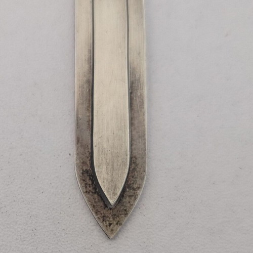 Silver bookmark with cross-shaped handle, used