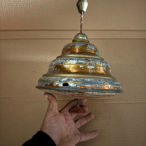 Old iron spinning top used in moderate condition