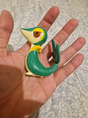 Snivy Pokémon figure used from McDonald's Happy Meal