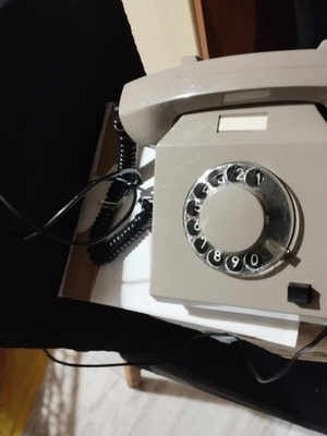 Plastic gray telephone from the 80s used with dial
