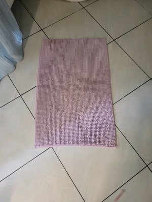 Bath mat used, lightly worn