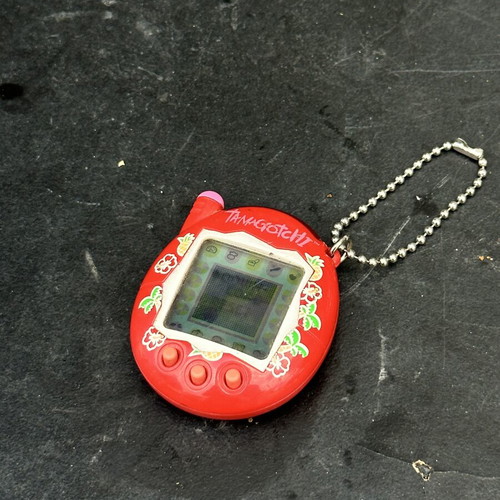 Vintage Tamagotchi Bandai 2004 red tropical design electronic keychain used