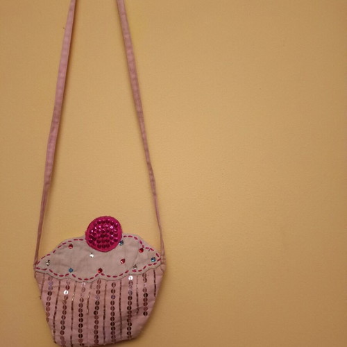 Cupcake bag like new, pink with zipper and long strap