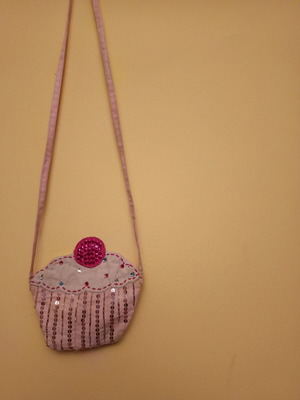 Cupcake bag like new, pink with zipper and long strap