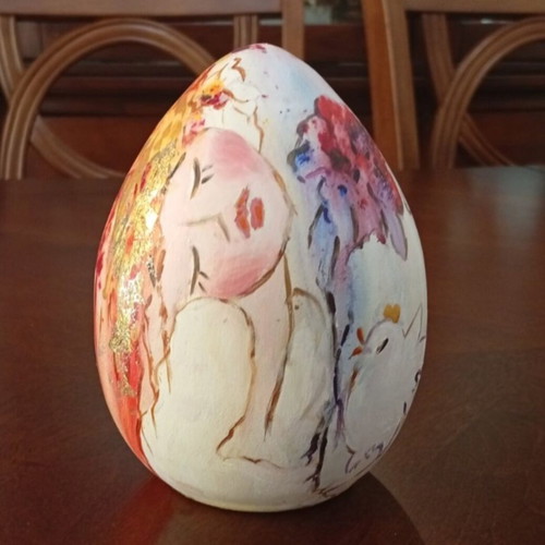 Hand-painted ceramic egg with floral and female figure design