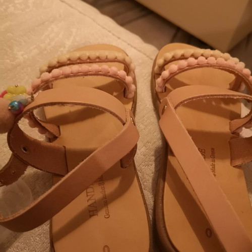 Handmade children's sandals size 30, beige with pom-poms