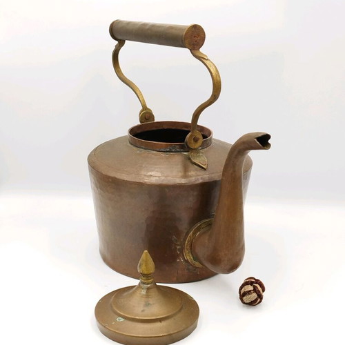 Vintage copper hand-forged teapot used with brass elements