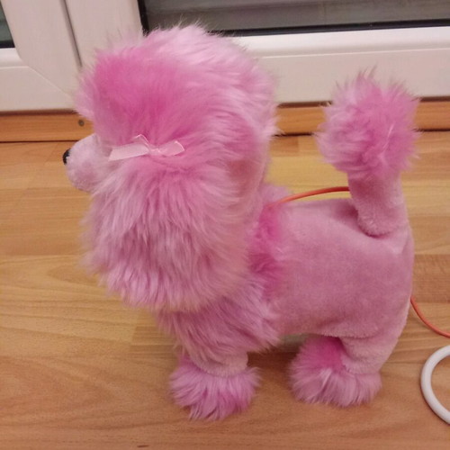 Toy dog with remote control like new that barks and moves