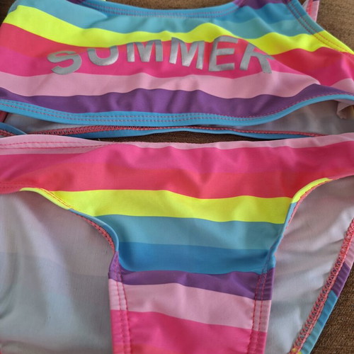 Girls' swimwear set like new, age 8, 3 swimsuits and 1 pareo