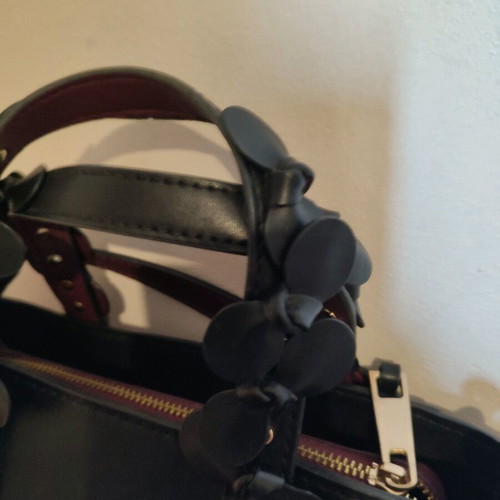 Vintage leather black bag used with flowers and burgundy interior