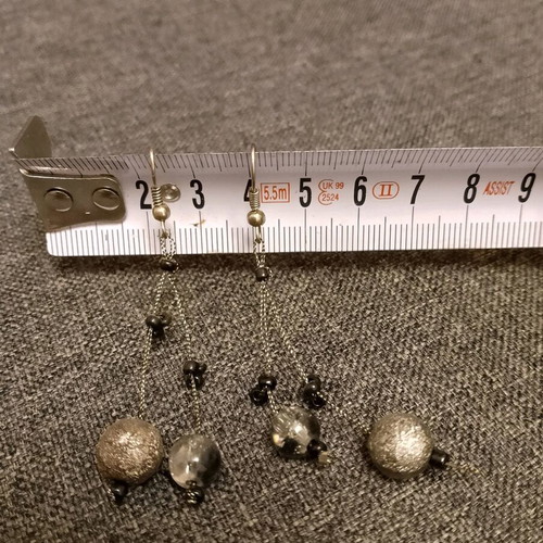 Dangling earrings used with black and gray beads