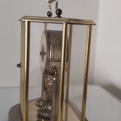 Vintage anniversary table clock with rotating pendulum (80s-90s)