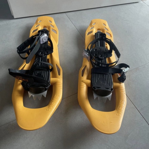 Sneka snowshoes used for hiking with metal crampons