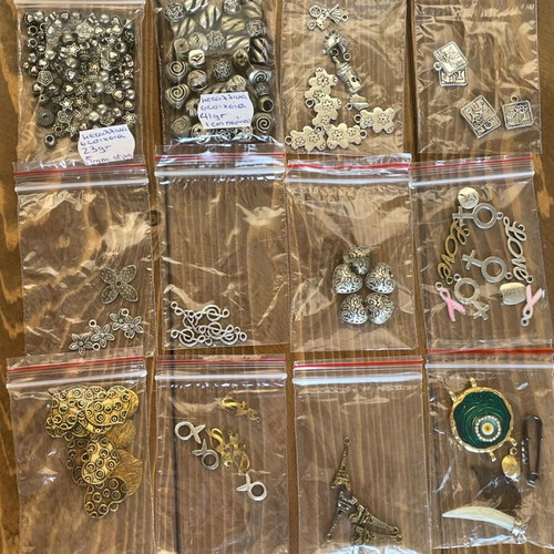 Metal beads and symbols pack like new, 12 bags