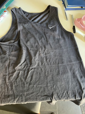 Nike sleeveless shirt used with slight sun discoloration, size M, black and blue