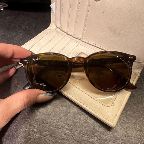 Authentic Ray Ban sunglasses used, with minor scratches