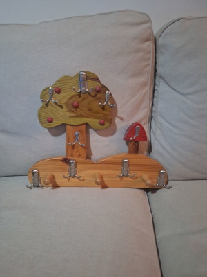 Wooden children's hanger used with minor defect