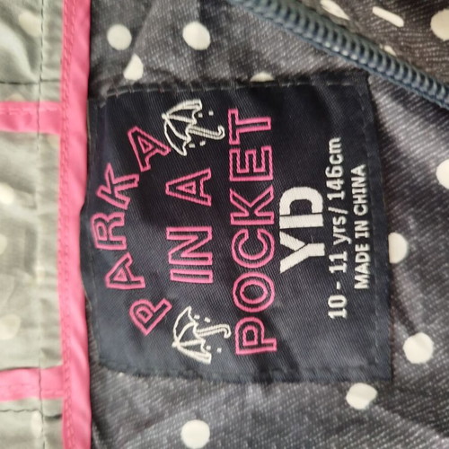 Girls' pocket raincoat 10-11 years like new, blue with white polka dots