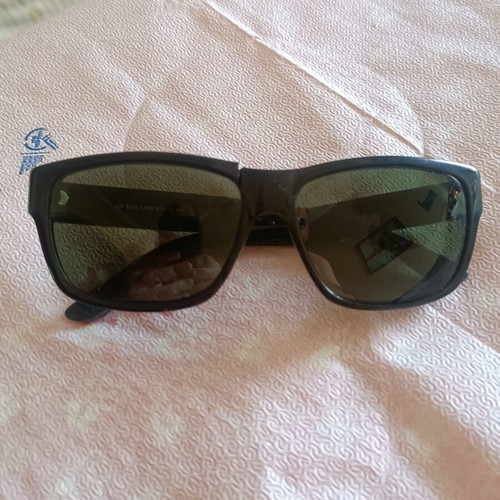 Ridley men's sunglasses with green lenses, broken frame