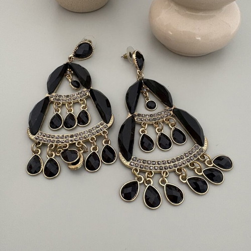 Dangling earrings used, large black and gold