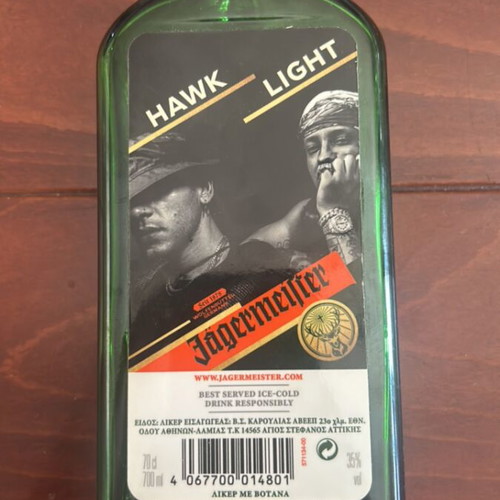 Jagermeister collectible bottle used, empty with Light & Hawk label
