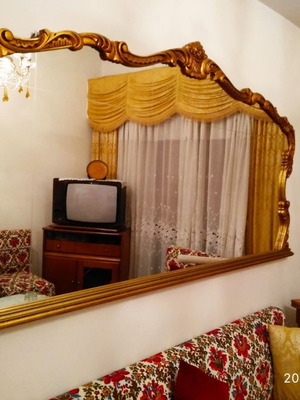 Classic carved mirror used with golden wooden frame
