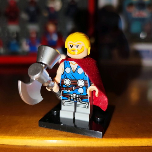 Unworthy Thor Lego figure like new with stand, cape, and axe