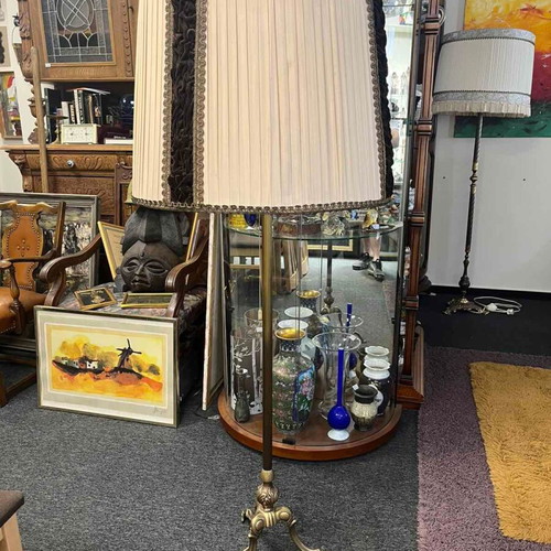 Vintage floor lamp used with ornate metal base and pleated fabric shade