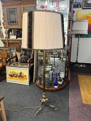 Vintage floor lamp used with ornate metal base and pleated fabric shade