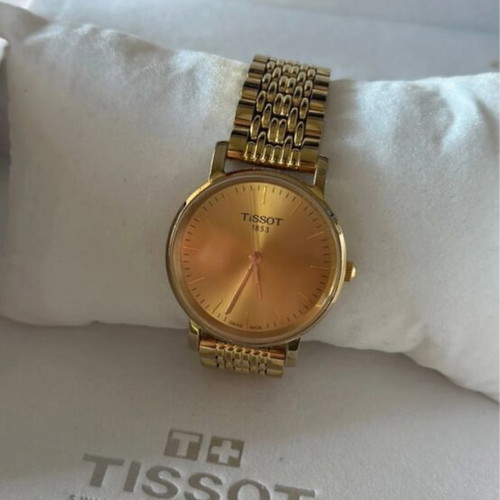 Tissot gold watch