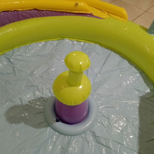 Inflatable colorful playpen used with balls and slides