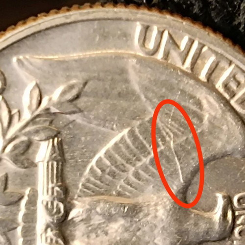 US quarter dollar 1965 used with mint error die break