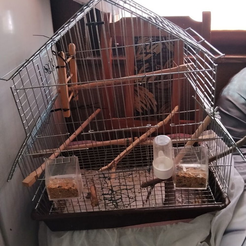 Birdcage for small and medium birds with house-shaped roof and accessories