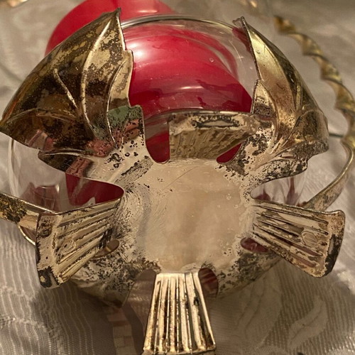 Metal candle holder with glass container used with candle