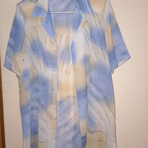 Light vintage women's shirt with short sleeves, buttons, collar, abstract print