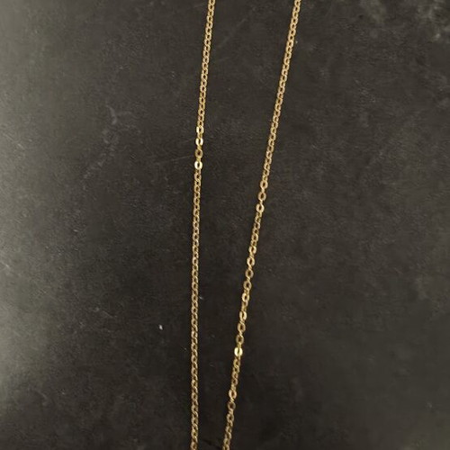 Necklace made of stainless steel like new, gold color with white Aries zodiac