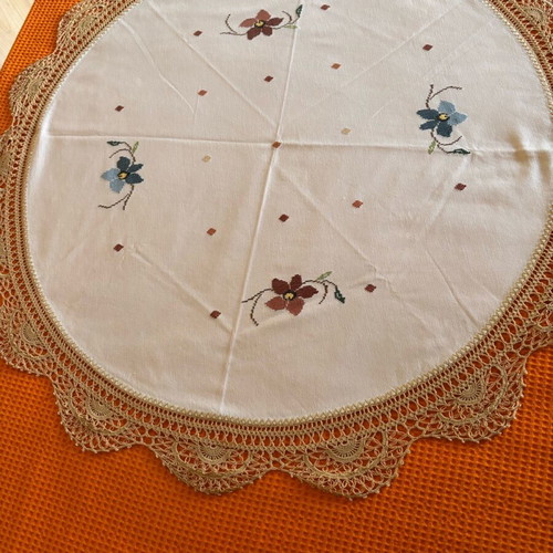 Round doily or small woven tablecloth with handmade edging like new