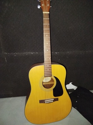 Fender electroacoustic guitar used with vintage Solitaire amplifier and stands