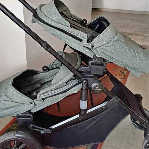 Twin stroller like new with footmuffs and carrycots