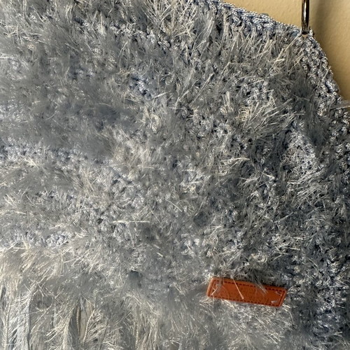 Handmade knitted shoulder bag turquoise with fringes and fluffy texture